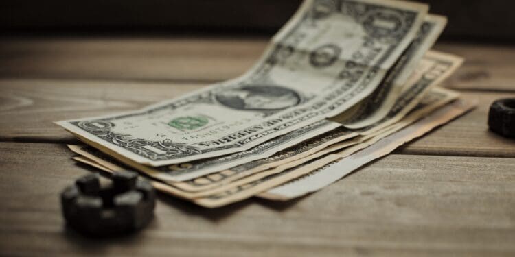 dollars on a wooden background
