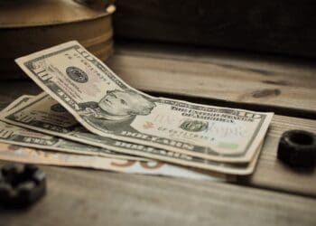 dollars on a wooden background