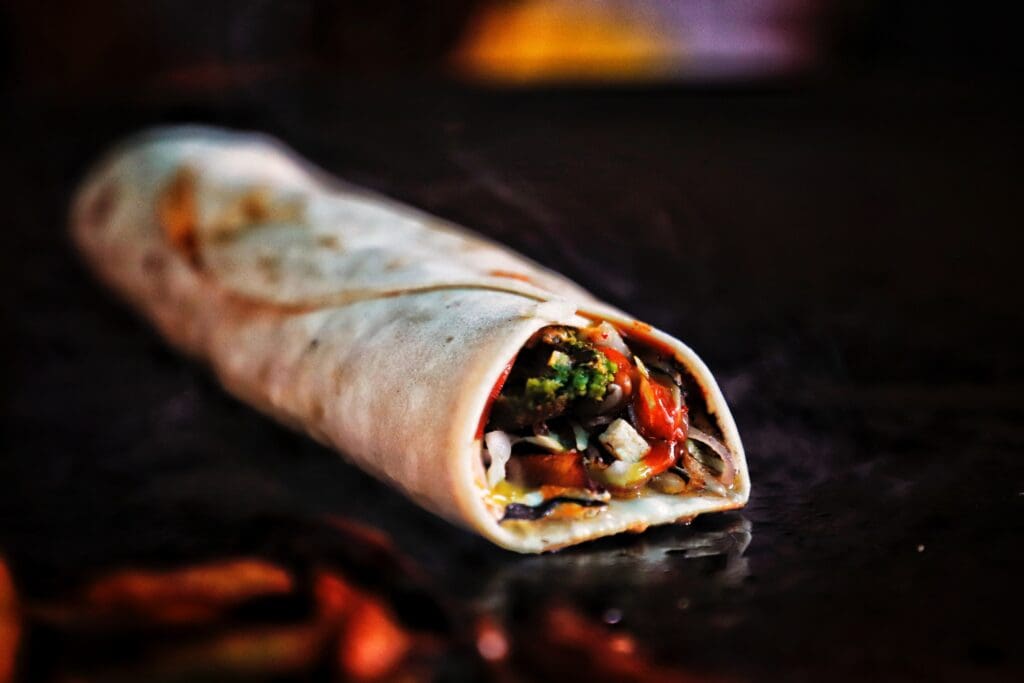 Falafel wrap is being cooked on a pan