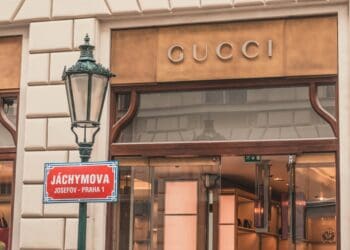 light sconce beside Gucci building signage at daytime