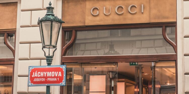 light sconce beside Gucci building signage at daytime