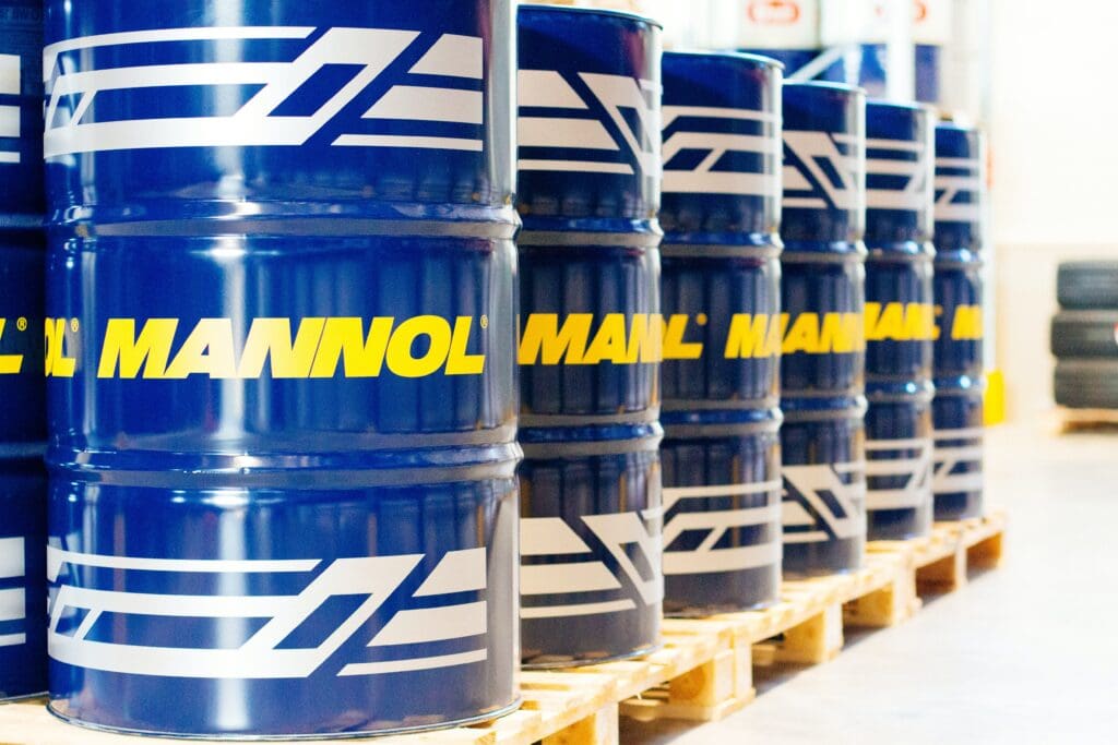 Mannol oil drums, oil barrels in warehouse for industrial editorials, marketing materials.