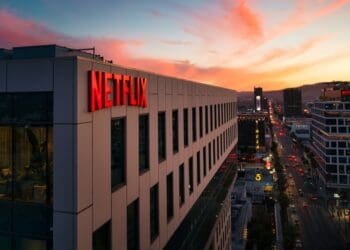 Netflix sign on a building at sunset.