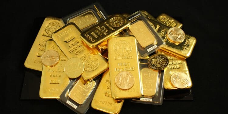 Pile of gold bullion coins and bars. Argor Heraeus, Münze Österreich and Krugerrand. If you use our photos, please add credit to https://zlataky.cz, when possible