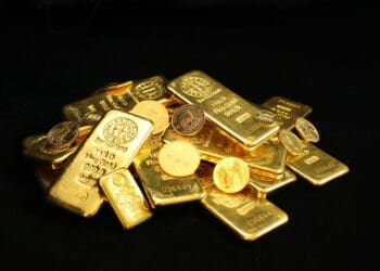 Pile of gold bullion coins and bars. Argor Heraeus, Münze Österreich, Royal Canadian Mint, U.S. Mint, Australian Mint of Perth, panda and Krugerrand. If you use our photos, please add credit to https://zlataky.cz, when possible