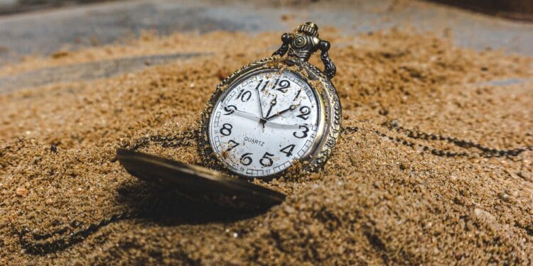 silver and white round analog watch at 10 10