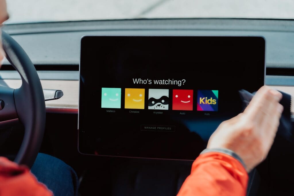 Tesla. A man sitting in a tesla using netflix. Maybe the reason for teslas stock value? Tesla Bilder von Malte Helmhold. You can request us to get more car pictures. Pictures of tesla cars or other cars.
