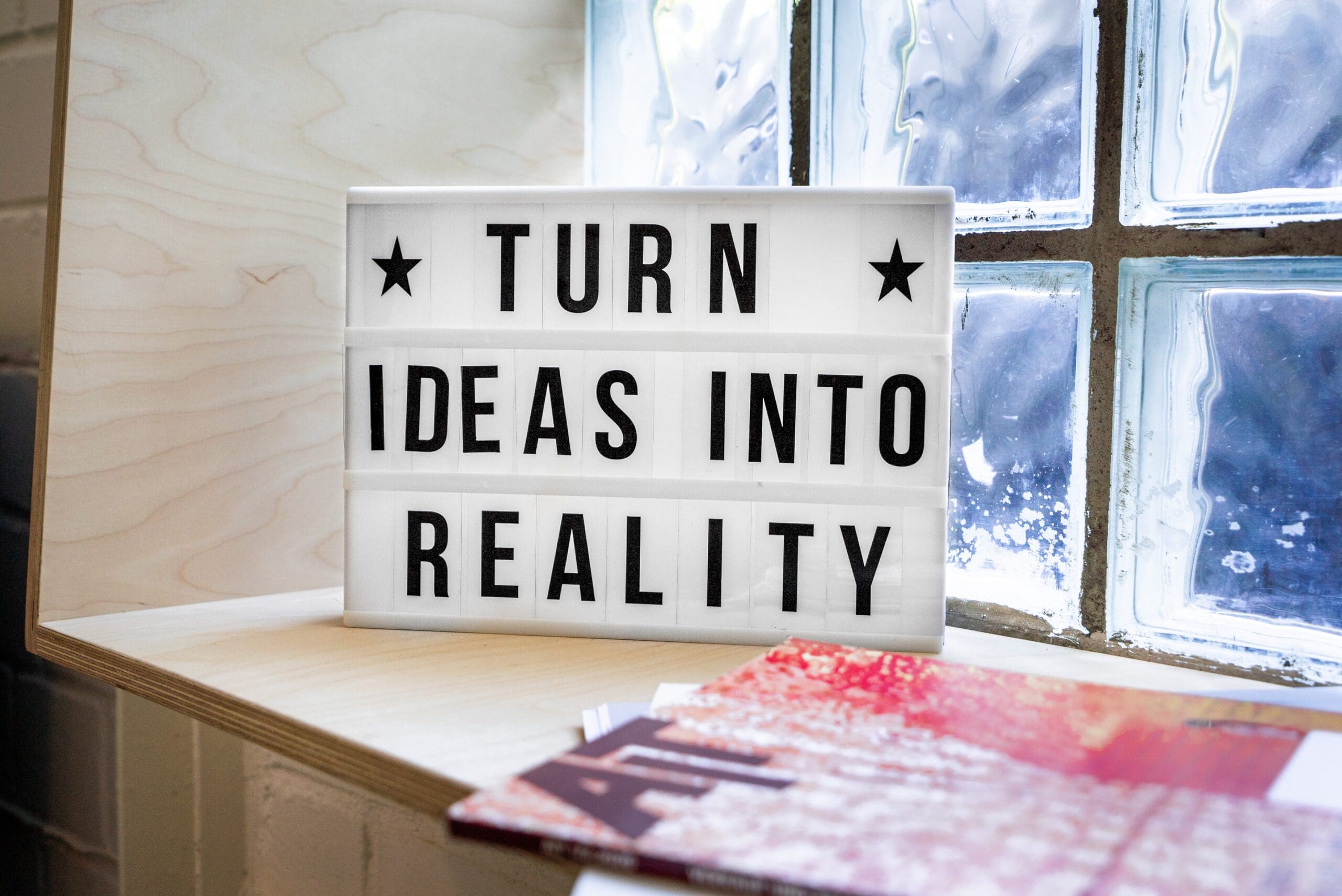 Turn Ideas into Reality! A motivational sign in a Co-Working Space.
