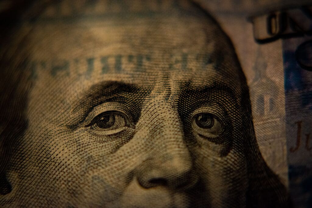 A closeup of a US hundred dollar bill <noread>(Benjamin Franklin side)</noread>.