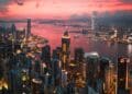 Cityscape of the Victoria Harbour region of Hong Kong during a magical sunset