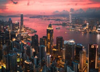 Cityscape of the Victoria Harbour region of Hong Kong during a magical sunset
