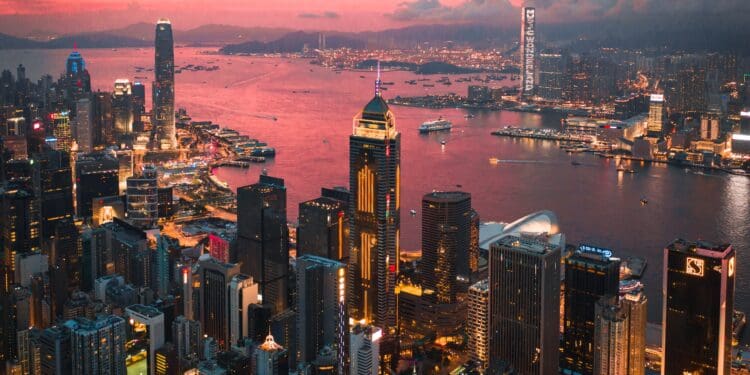 Cityscape of the Victoria Harbour region of Hong Kong during a magical sunset