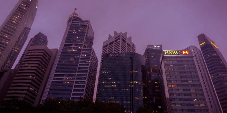 Looking up at the towers of Singapore on a cloudy evening.