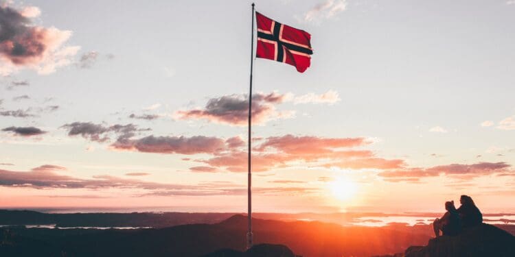 Norway flag standing on cliff