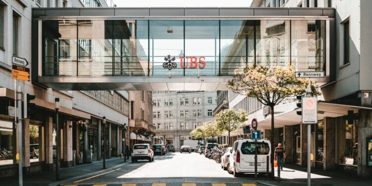 UBS logo on glass bridge wall during daytime