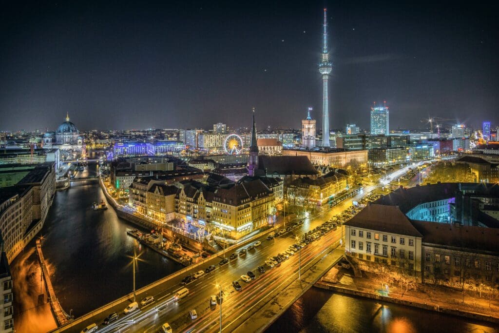 View over the River Spree to Nikolaiviertel and Alexanderplatz. The Nikolaiviertel is the reconstructed historical heart of the German capital Berlin. The Nikolaikirche <noread>(Saint Nicholas Church)</noread> gives its name to the neighbourhood five minutes away from Alexanderplatz. The Alexanderplatz is a large public square and transport hub in the central Mitte district of Berlin, near the Fernsehturm the Rotes Rathaus, the town hall of Berlin.