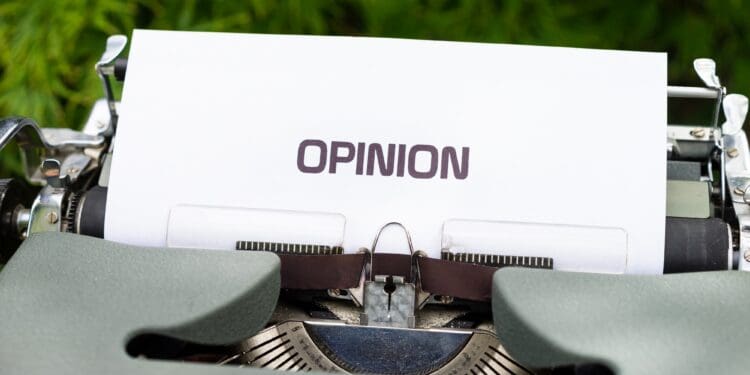 white and black typewriter on green grass during daytime