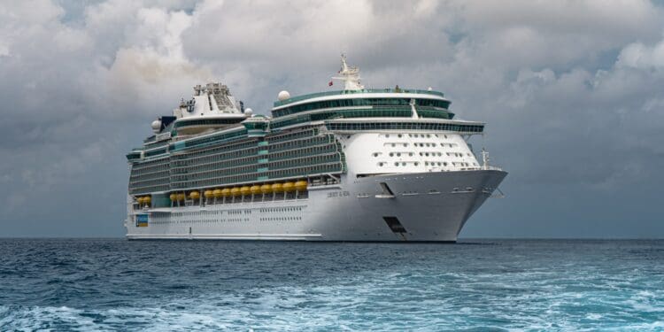 white cruise ship on sea under white clouds and blue sky during daytime