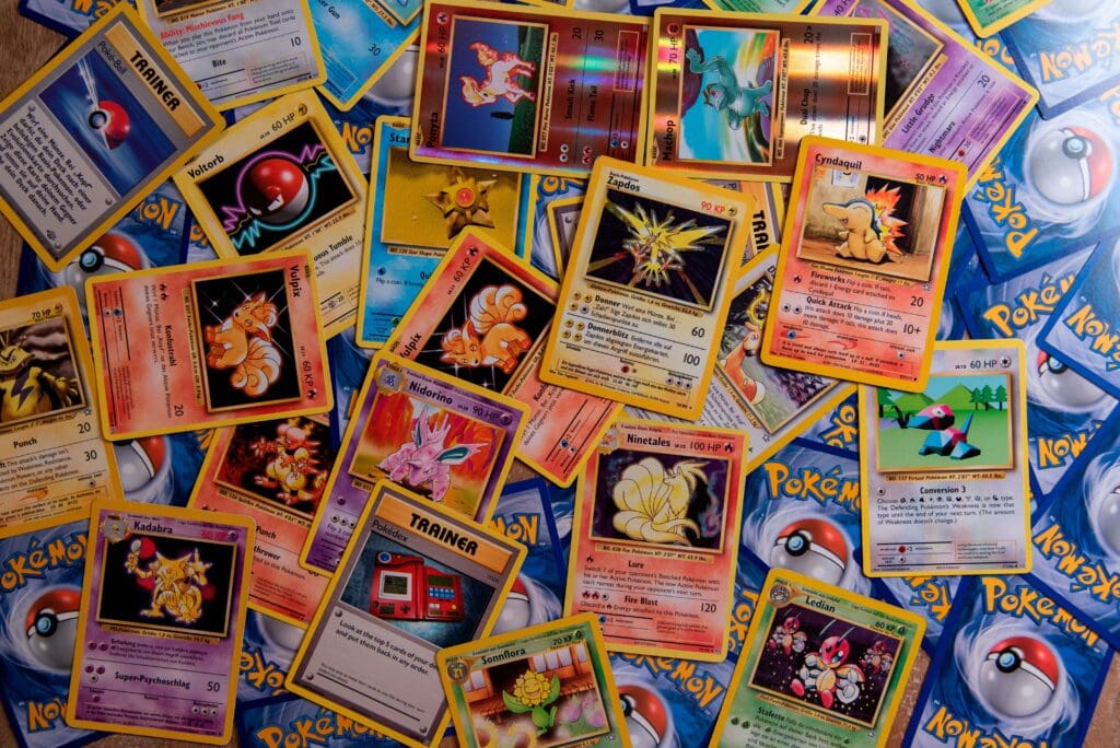 A bunch of Pokémon Trading Cards with Zapdos, Ninetales, Porygon, Cyndaquil, Ponyta, Machop, Vulpix and many more.