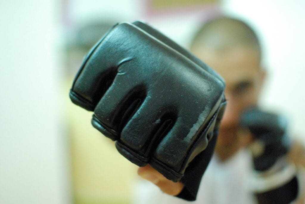 Close up man punch with fight glove - front view