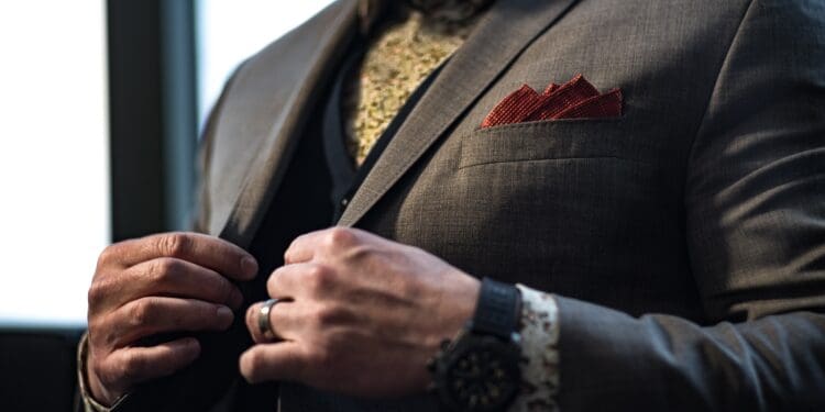 man wearing grey notched-lapel suit jacket