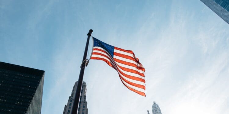 USA flag on pole at the city during day