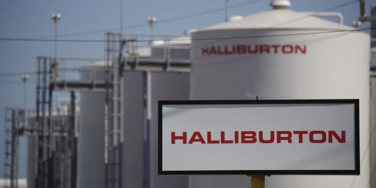 Halliburton Co. signage is displayed alongside storage tanks in Port Fourchon, Louisiana, U.S., on Thursday, June 11, 2020. Oil eclipsed $40 a barrel in New York on Friday, extending a slow but relentless rise thats been fueled by a pick-up in demand and could signal a reawakening for U.S. shale production. Photographer: Luke Sharrett/Bloomberg