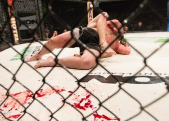 Blood covers the mat during an MMA fight in Montana.