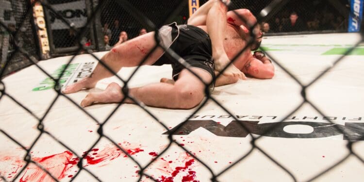 Blood covers the mat during an MMA fight in Montana.