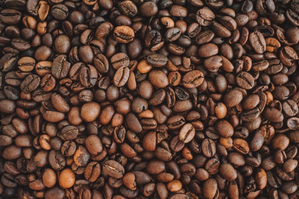 Continuous background of fresh arabica coffee beans