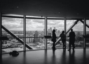 meeting near a transparent glass