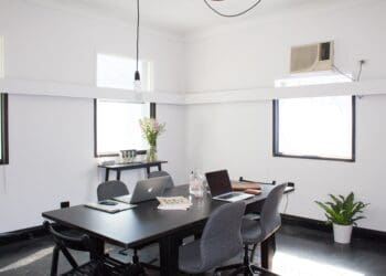 rectangular brown wooden table with chairs
