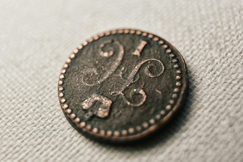 A copper russian coin from the time of Nicholas I reigned as Emperor of Russia, King of Poland and Grand Duke of Finland from 1825 until 1855. Vintage macro photo with a shabby copper coin from the early 19th century. Numismatics background for 19th century coin collectors