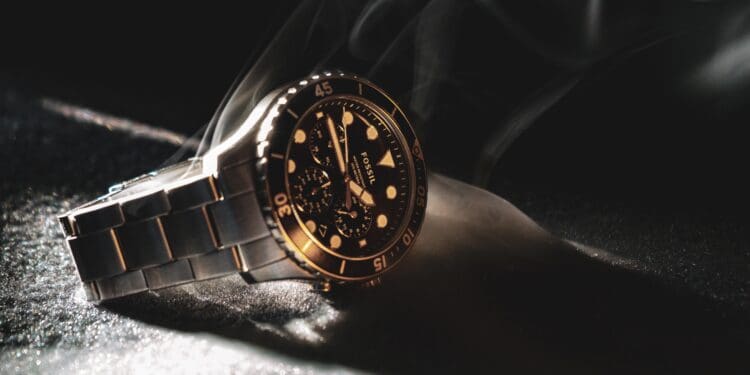 black and gold analog watch