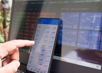 Forex trading using smartphones and laptops.