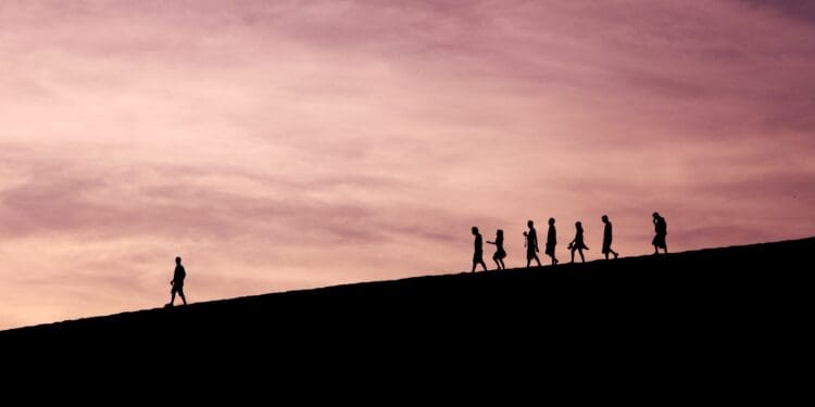 silhouette of people on hill