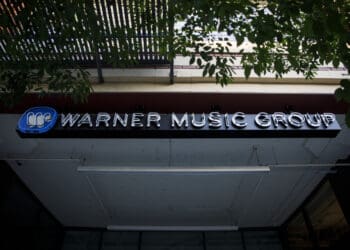 Warner Music Group Inc. signage is displayed outside the company's headquarters in the Arts District neighborhood of Los Angeles, California, U.S., on Wednesday, June 3, 2020. Warner Music Group's shareholders have raised $1.93 billion in an upsized initial public offering that ranks as one of the biggest U.S. listing this year. Photographer: Patrick T. Fallon/Bloomberg via Getty Images