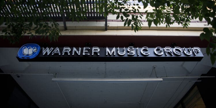 Warner Music Group Inc. signage is displayed outside the company's headquarters in the Arts District neighborhood of Los Angeles, California, U.S., on Wednesday, June 3, 2020. Warner Music Group's shareholders have raised $1.93 billion in an upsized initial public offering that ranks as one of the biggest U.S. listing this year. Photographer: Patrick T. Fallon/Bloomberg via Getty Images