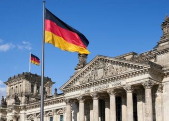 Close-up Deutscher Reichstag with german national flags