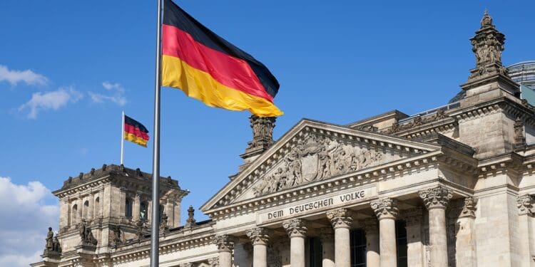 Close-up Deutscher Reichstag with german national flags