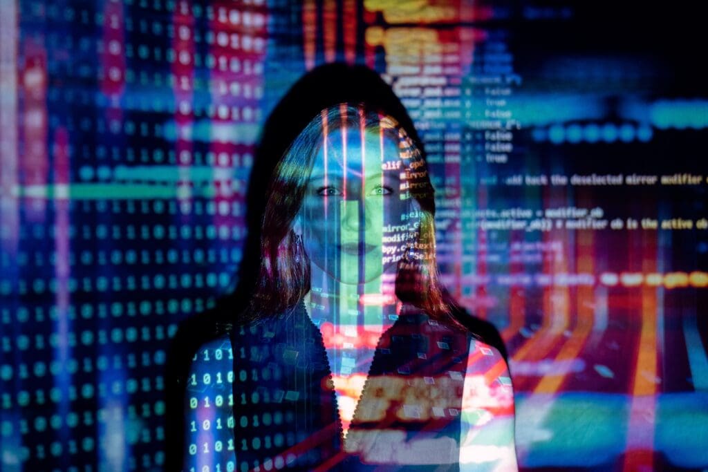 Female software engineer with projected code