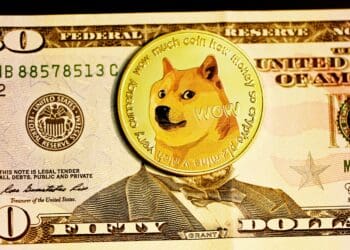 The famous Shiba Inu meme coin, Dogecoin, placed on top of a $50 bill.