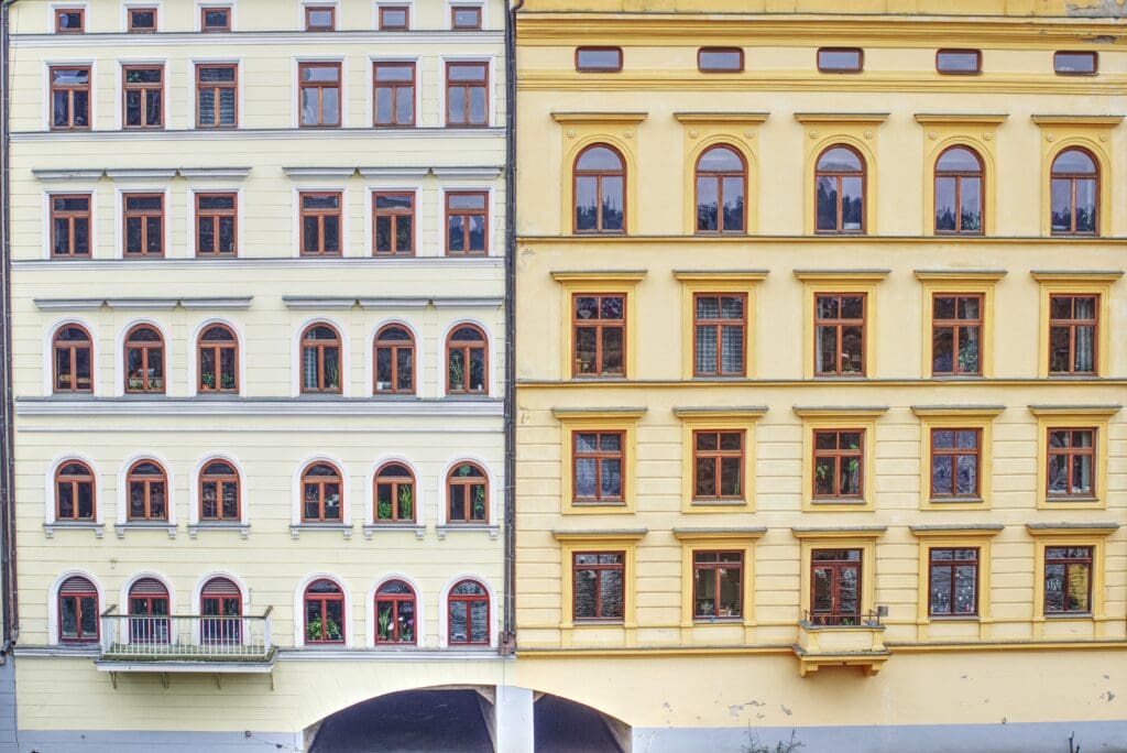 Two buidings near a river