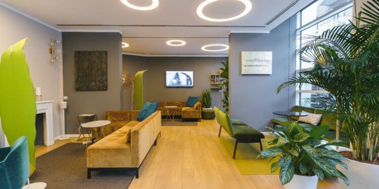 brown wooden table near green plant