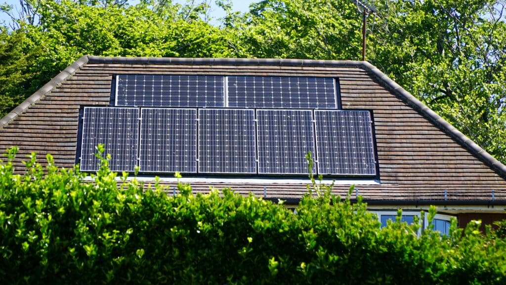 Monocrystalline solar panels embedded into a house roof