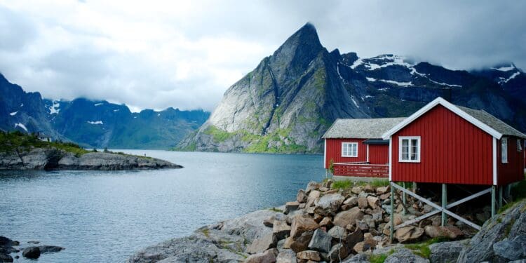Near Reine, Norway the Eliassen Rorbuer overlooks Moskenesøya.  This is just one of many tiny fishing villages between the Lofoten Islands which is a fantastic place to eat or sleep while visiting the Arctic Circle.