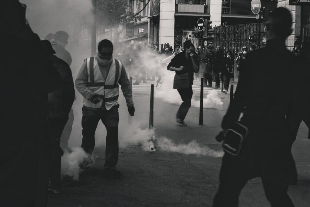 Police fires tear gas at Yellow Vest demonstrators during the 25th weekend of protests in the streets of Lyon, France.Police violence is at its highest since the 1950s. There is an extensive use of tear gas, sting-ball grenades and LBDs <noread>("defense ball launchers")</noread> against largely peaceful protestors. According to official numbers, as of now, 1.428 tear gas grenades and 13.460 rubber bullets have been fired.As of now <noread>(May 5th, 2019)</noread>, 23 persons lost an eye and 5 persons their hand during protests <noread>(source: mediapart.fr, http://tiny.cc/6hd85y)</noread>.