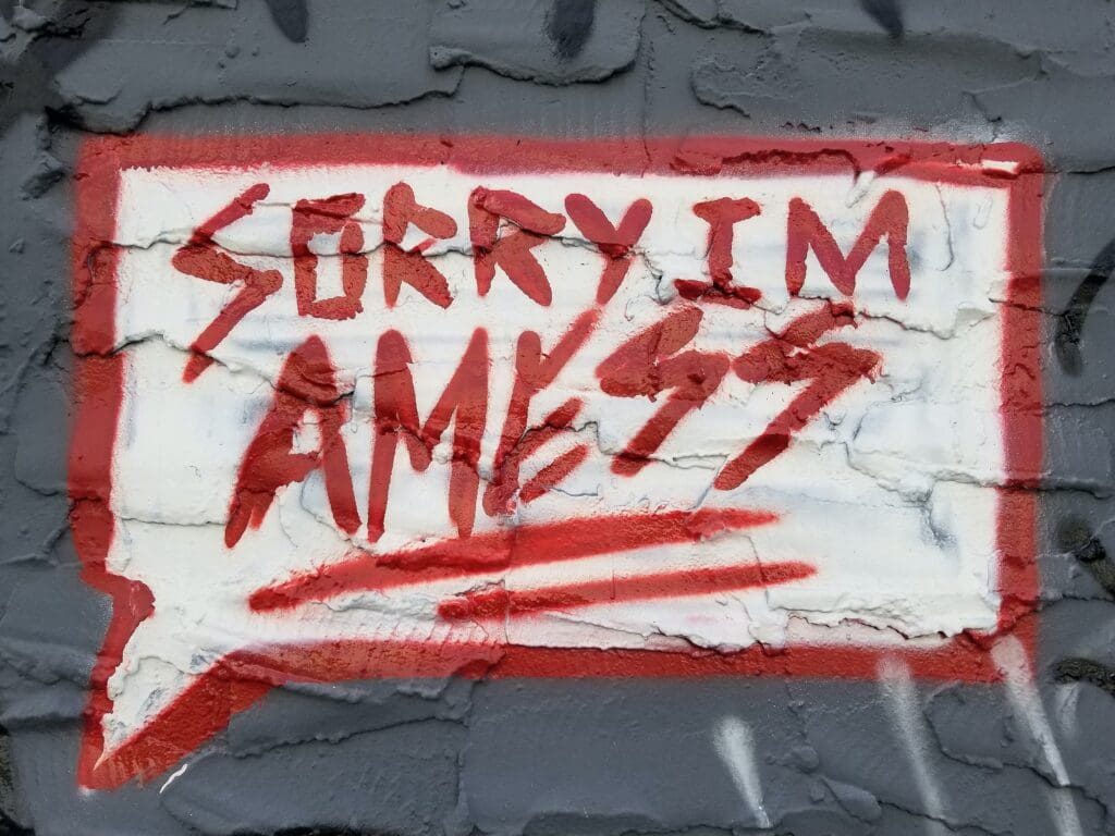 red and white graffiti on wall