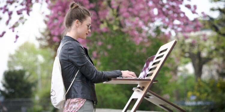 woman working outdoors on a standing desk