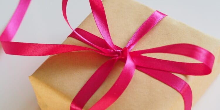 brown gift box with pink ribbon